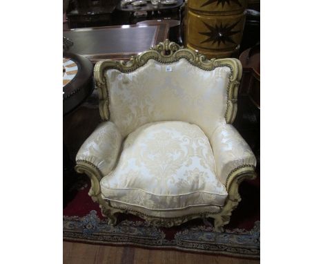 A PAIR OF CONTINENTAL CREAM PAINTED PARCEL GILT AND UPHOLSTERED ARMCHAIRS each with a C scroll and foliate carved top rail ab