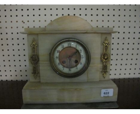 AN ONYX AND BRASS MOUNTED CLOCK of architectural form the brass dial with applied gilt brass mounts on stepped platform base 