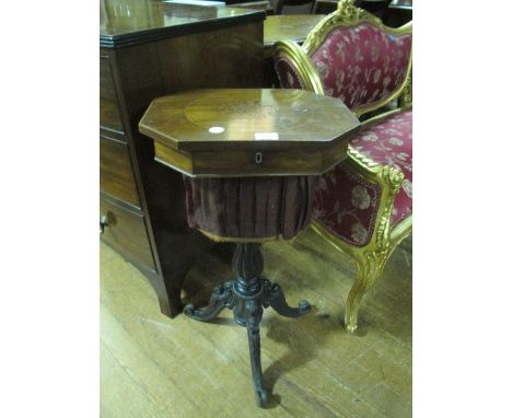 A VICTORIAN ROSEWOOD AND MAHOGANY WORK TABLE the rectangular top with canted angles and marquetry panel with hinged lid conta