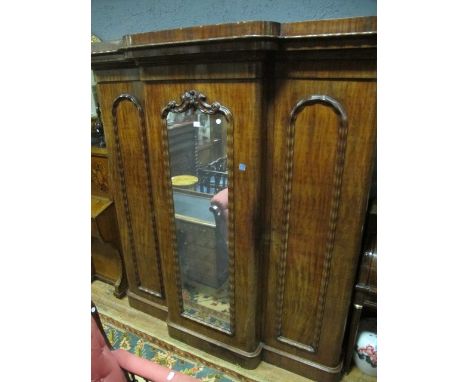 A VERY FINE VICTORIAN MAHOGANY THREE DOOR WARDROBE the moulded cornice above a central mirrored door flanked on each side by 