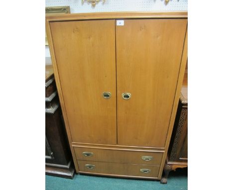 A DREXEL WALNUT TWO DOOR TV AND VIDEO CABINET with panel doors the base containing two long drawers