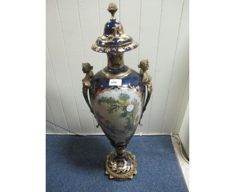 A FINE PAIR OF FRENCH GILT BRASS LIDDED VASES each of cylindrical form the blue and gilt ground with oval painted panel depic