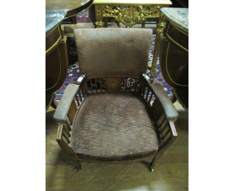 AN EDWARDIAN MAHOGANY AND SATINWOOD INLAID ARMCHAIR with upholstered back, seat and arm rests on square tapering legs with br