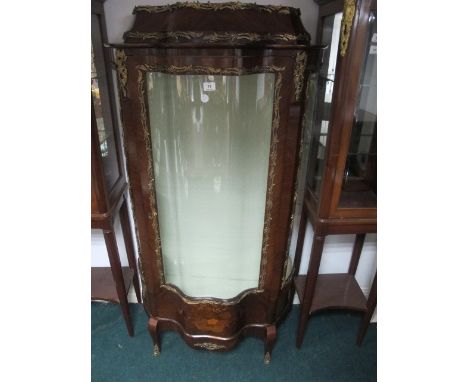 A GOOD FRENCH KINGWOOD GILT BRASS MOUNTED DISPLAY CABINET of bombe outline the stepped pediment above an astragal glazed door