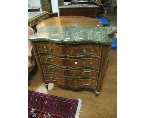 A CONTINENTAL WALNUT KINGWOOD AND GILT BRASS MOUNTED CHEST of serpentine outline surmounted with a green vein marble top abov
