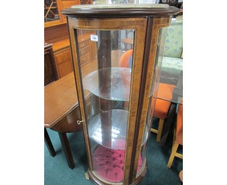 A CONTINENTAL KINGWOOD AND GILT BRASS MOUNTED CHINA DISPLAY CABINET of cylindrical outline the shaped moulded top with vein m