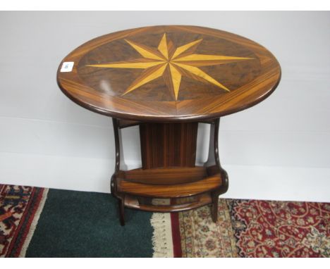 A WALNUT AND MARQUETRY MAGAZINE TABLE the oval table with inlaid panel above an open compartment on splayed legs 62cm (h) x 5