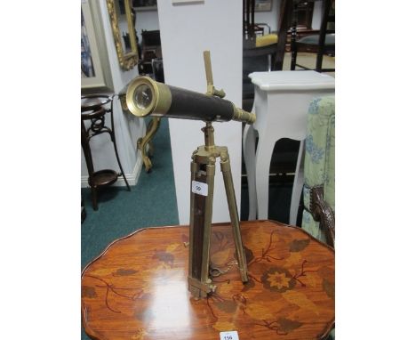 A BRASS AND LEATHER BOUND TABLE TOP TELESCOPE raised on telescopic tripod support telescope 43cm long