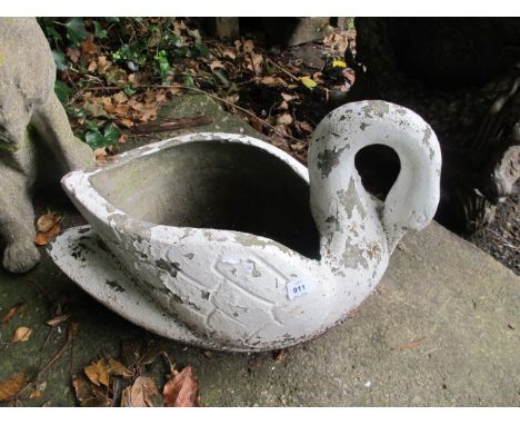 A COMPOSITION STONE PLANTER modelled as a swan 40cm high