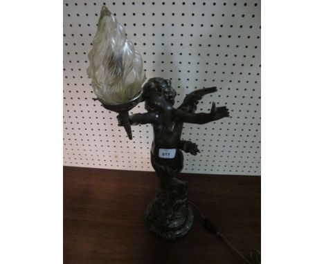 AFTER AUGUSTOS MOREALL A BRONZED TABLE LAMP in the form of a winged cherub holding a torch aloft raised on a green vein marbl