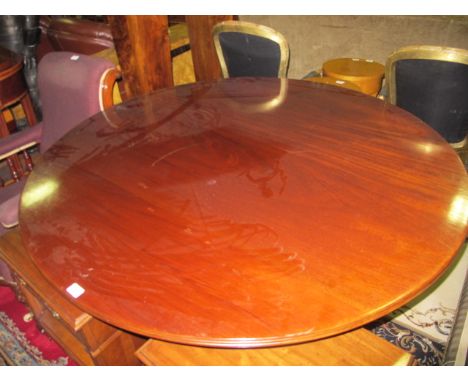 A GEORGIAN STYLE MAHOGANY POD TABLE the circular top with reeded rim above a spiral twist column on tripod support with brass