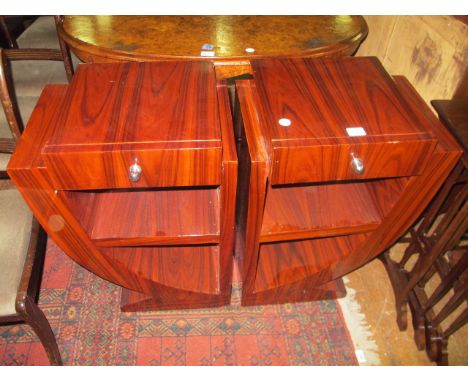 A PAIR OF ART DECO STYLE ROSEWOOD TABLES each with a stepped top and frieze drawer above open compartments on curved supports
