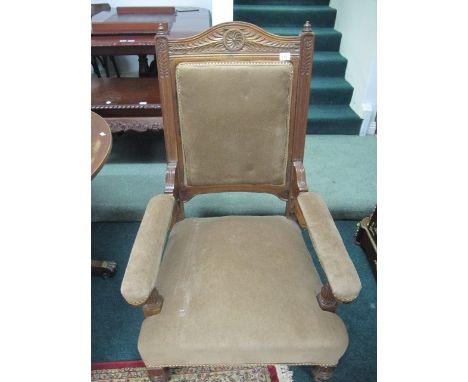 AN EDWARDIAN MAHOGANY GENTS CHAIR the arched top rail above an upholstered panel and seat on lobed tapering legs