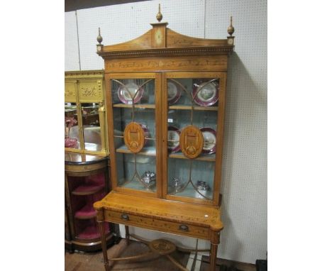 A VERY FINE AND IMPRESSIVE PAIR OF SATINWOOD AND POLYCHROME DISPLAY CABINETS each with a dentil moulded cornice above astraga