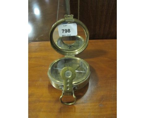A BRASS COMPASS inscribed "Thomas J Evans Esquire London"