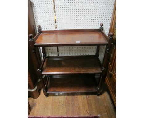 A VICTORIAN MAHOGANY THREE TIER DUMB WAITER each rectangular moulded shelf joined by baluster supports on turned legs 109cm (
