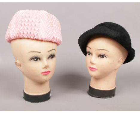 Two vintage shop mannequin heads. 