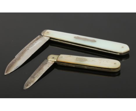 Two Victorian silver fruit knives with mother of pearl scales assayed Sheffield 1841 and 1854. 