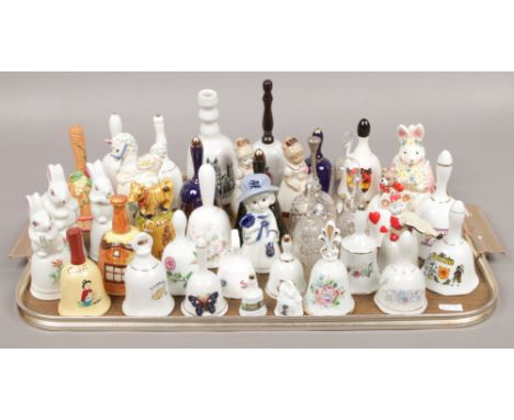 A tray of ceramic bells to include Ashley bone china, Canterbury cathedral examples. 