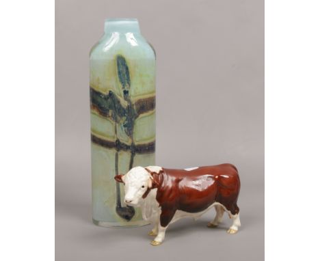 A Beswick ceramic model of a Hereford bull (with restoration) along with an Art glass vase bearing signature to the base 35.5