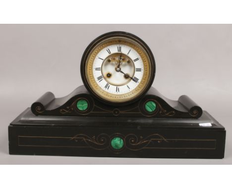A Victorian slate mantle clock with visible anchor escapement and malachite decoration. 