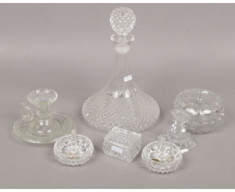 A collection of cut crystal to include decanter, candlesticks, trinket examples. 