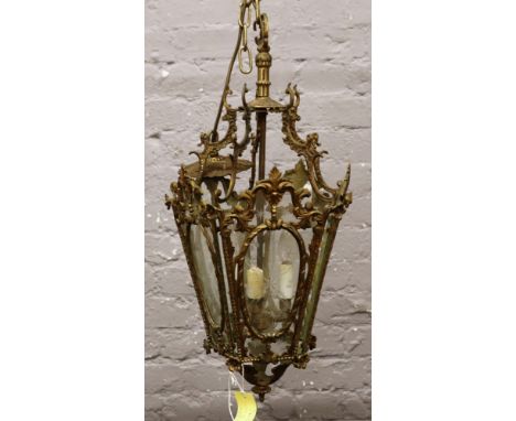 A brass and cut glass ornate lantern light fitting. 