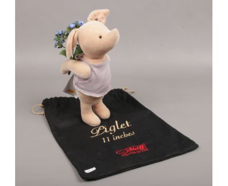 A Steiff Disney showcase collection piglet with original bag. 