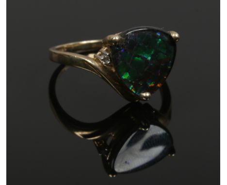 A 9ct gold and diamond ammolite ring, size R. 