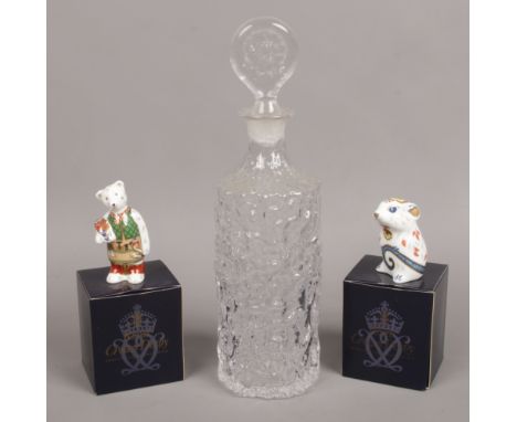 A Whitefriars clear glass decanter and two Royal Crown Derby figures Mouse and Teddy Bear Gardener. 