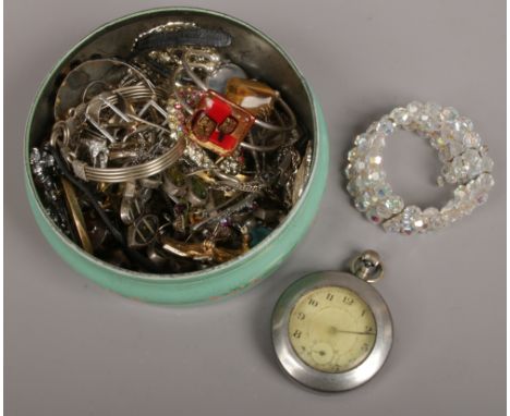 A vintage confectionery tin and assorted costume jewellery and a ladies Rotary wristwatch. 