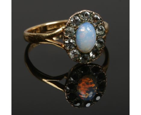 A ladies 22ct gold opal / white paste cluster ring, size O gross weight 4.11 grams. 