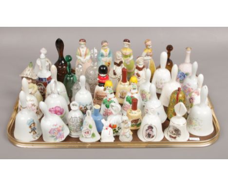 A tray of ceramic bells to include Madame Tussauds, Petticoats and Pantaloons examples. 