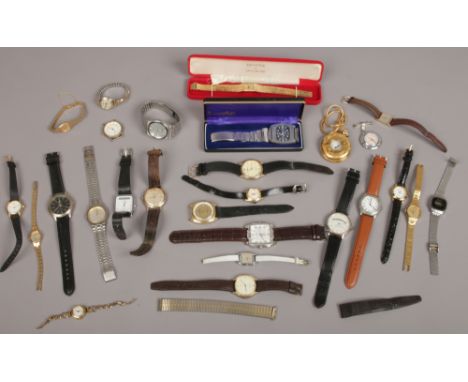 A box of ladies and gents wristwatches, quartz and manual including gentleman's stainless steel Buler bracelet watch with dat