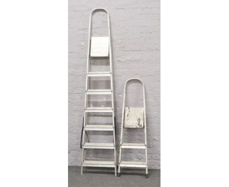 Two sets of aluminium step ladders. 