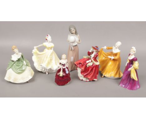 Seven ceramic figures of ladies to include Royal Doulton, Lladro and Coalport. 