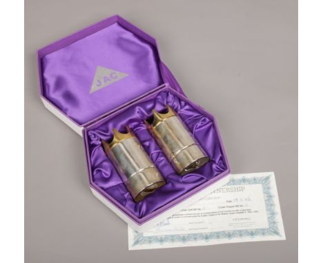 A boxed pair of limited edition silver and silver gilt pepper mills by J. A. Campbell. In memoration of H. M. Queen Elizabeth