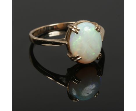 A ladies 9ct gold opal ring, size R, 2.76 grams. 