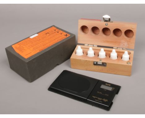 An assay tester and Tanita digital scales. 