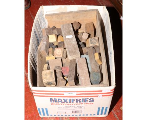 A box of vintage wooden building blocks. 