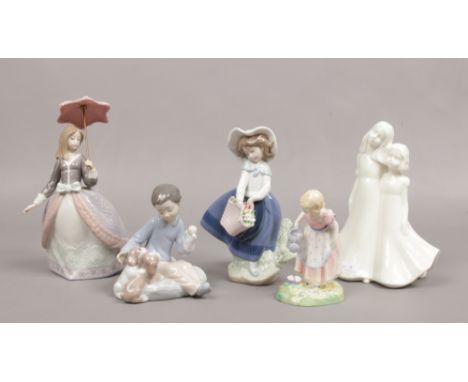 A collection of ceramic figures to include three Lladro examples etc. 