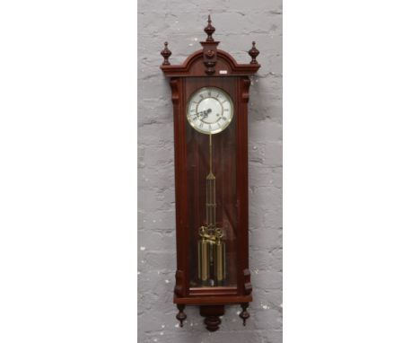 A mahogany 8 day wall clock. 