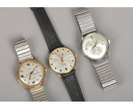 Three gentleman's manual wristwatches. Everite with centre seconds and date display, Timex with centre seconds, day and date 