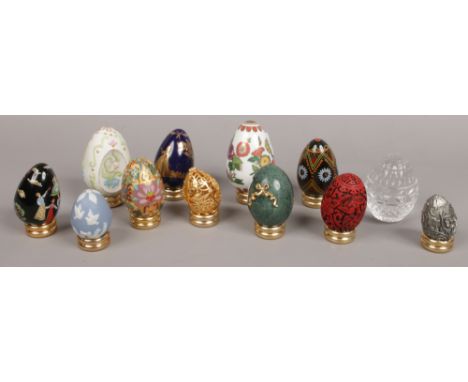 A collection of ornamental eggs to include ceramic and glass examples etc. 
