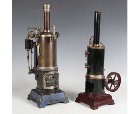 A spirit-fired vertical steam engine, possibly Bing, the single cylinder driving an 8cm flywheel, on bracket feet, height 35.