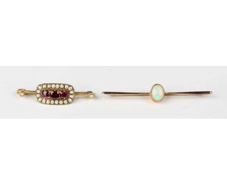 A gold and opal single stone bar brooch, unmarked, weight 3.8g, width 5.6cm, and a gold, garnet and seed pearl bar brooch, un