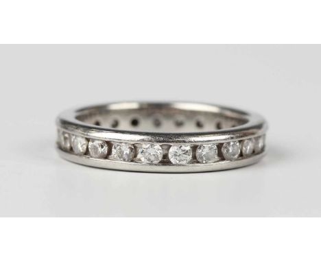 A platinum and diamond eternity ring, channel set with circular cut diamonds, Edinburgh 2014, weight 5.7g, total diamond weig