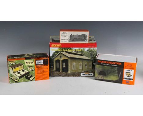 A collection of gauge OO Hornby and Peco track, including curves, straights, points and crossovers, a Hornby Skaledale East e