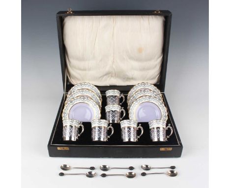 A set of six George V silver coffee can holders with Aynsley bone china liners and saucers, Sheffield 1925 and 1926 by James 
