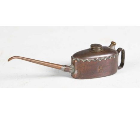 A Meccano 'K' small copper and brass oil can, together with a Meccano price list.